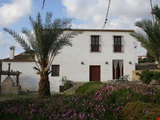 Photo of Restored ancient watermill close to a sandy beach and golf course